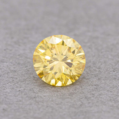 0.23 Carat Fancy Intense Yellow Round Diamond, SI2, GIA Certified